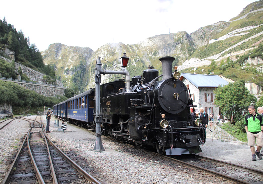 Steam locomotive taking on water