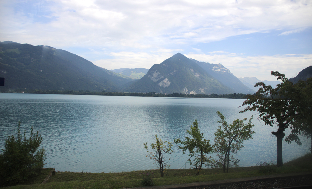 Lake and mountains as seen from train window