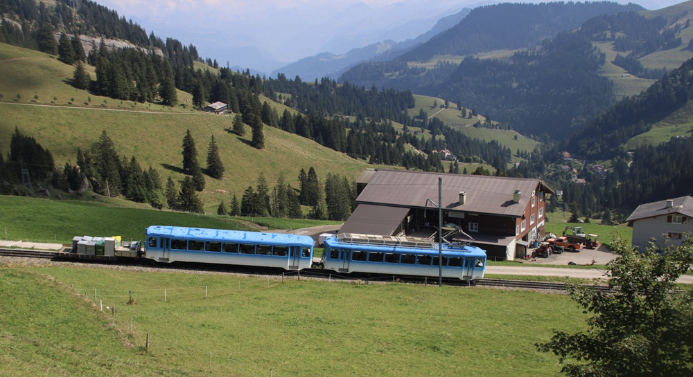 Blue and white cog railway train