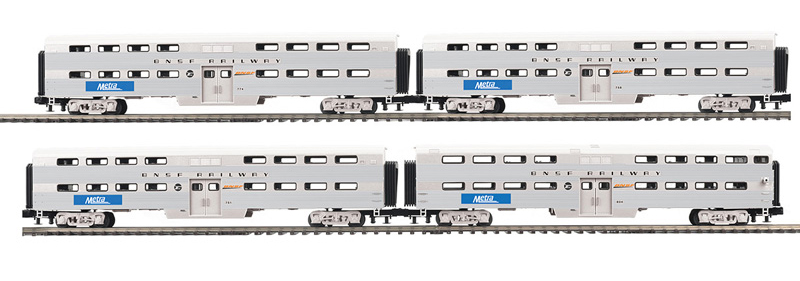 Photo showing four O gauge commuter cars