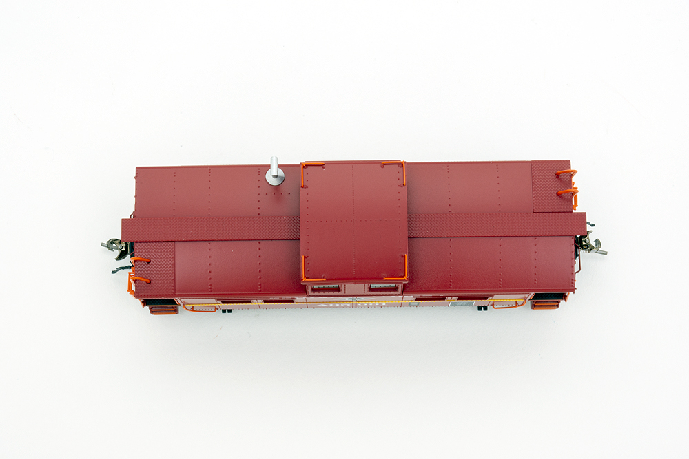 Red caboose roof with centered cupola.