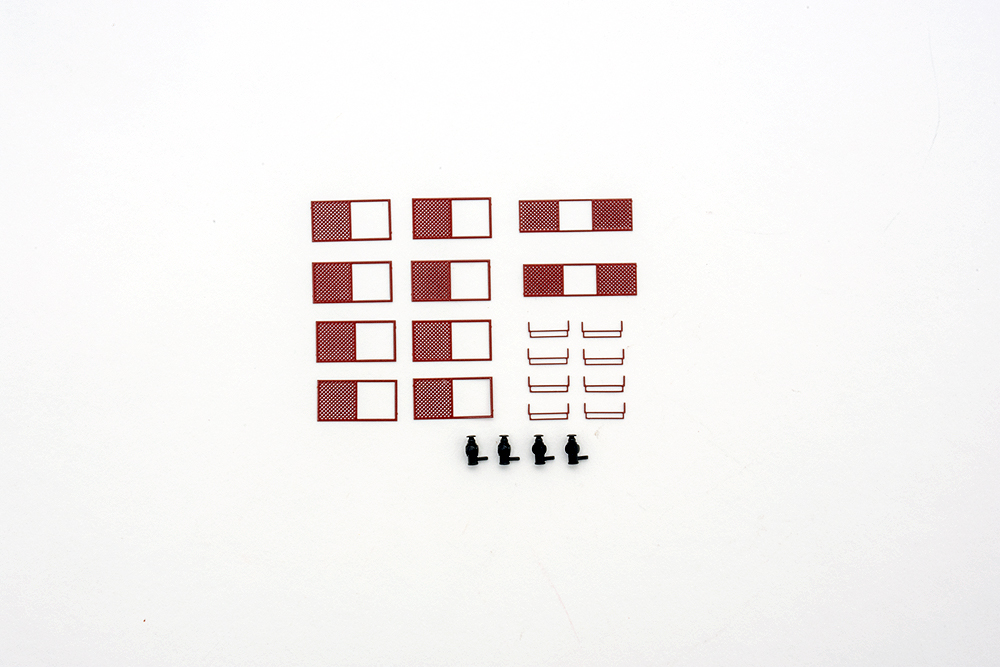 Red-painted window rock screens and black lantern-style marker lights