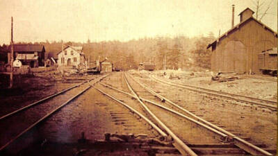 Black and white photo of a 2-stall engine house.