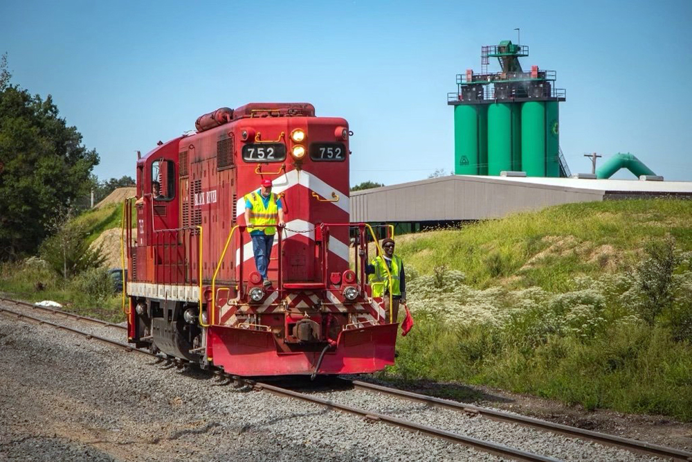 red locomotive by grass
