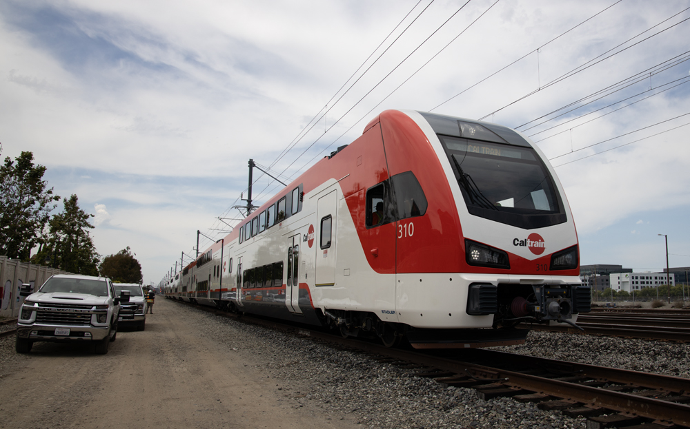 Red and white electric trainset on test track