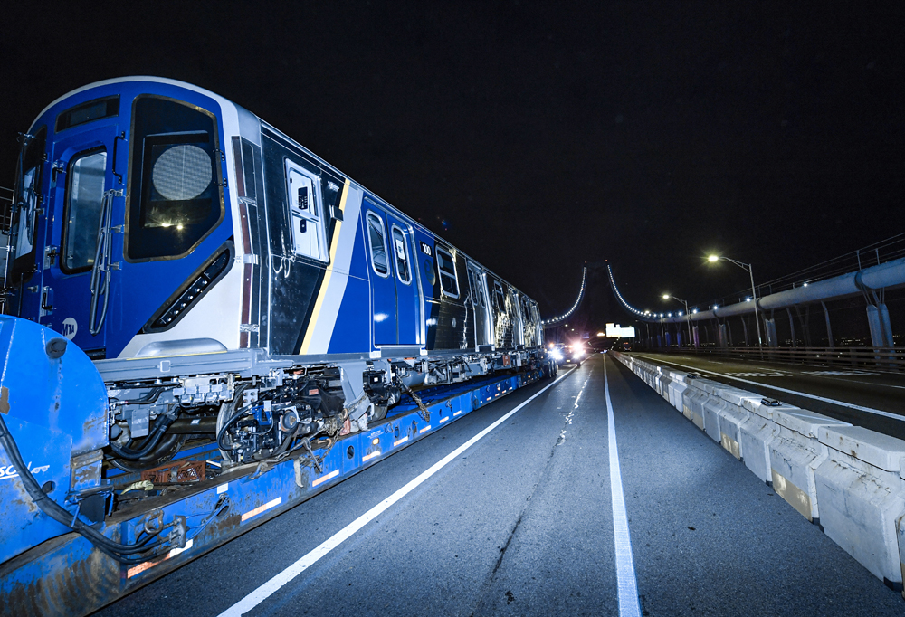 Subway car on truck crossing bridge