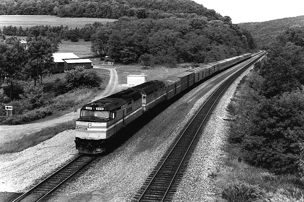 overnight Amtrak trains with two locomotives in mountain valley