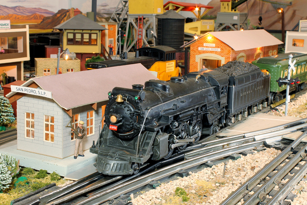 black steam locomotive model on layout: Lionel No. 225E 2-6-2 steam engine