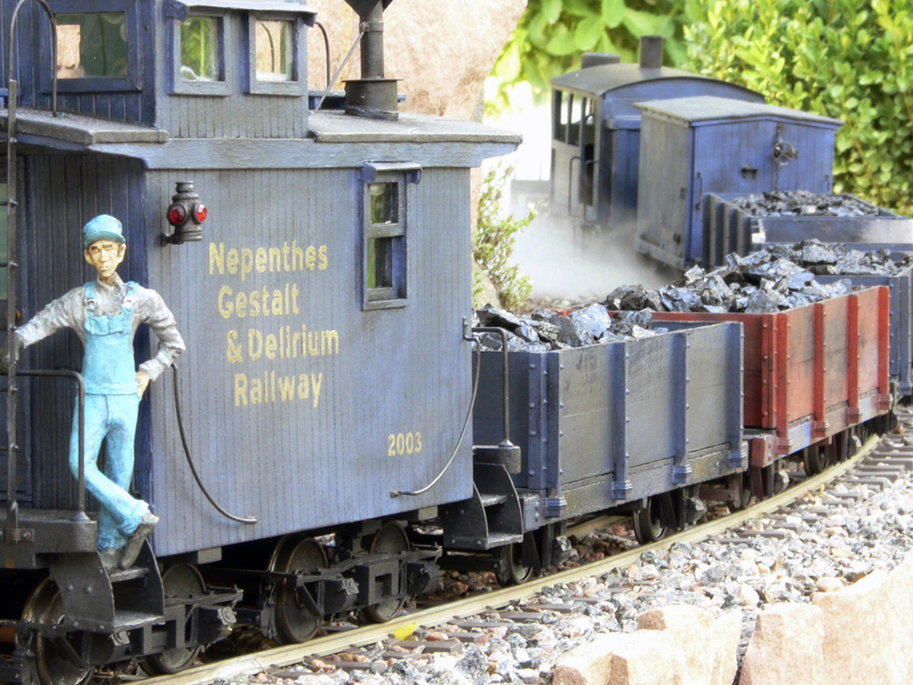 model figure on side of model engine