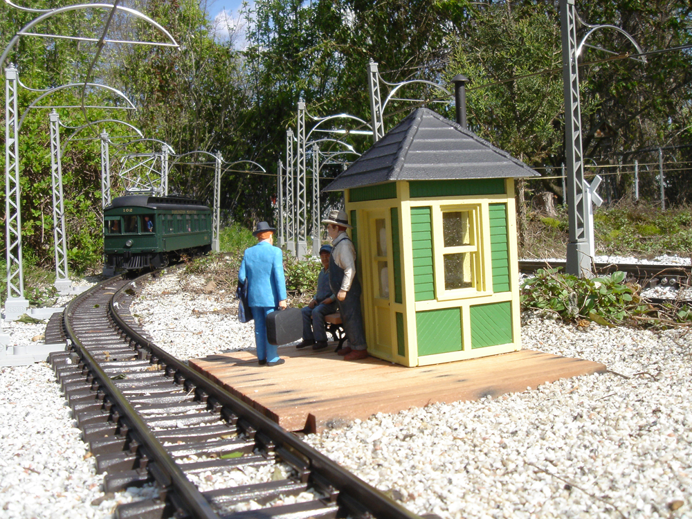 model structure with figure and track on garden railway