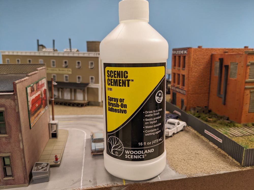 A bottle of Woodland Scenics Scenic Cement