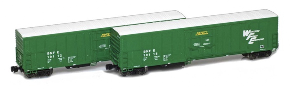 A set of two model freight cars in a green paint scheme