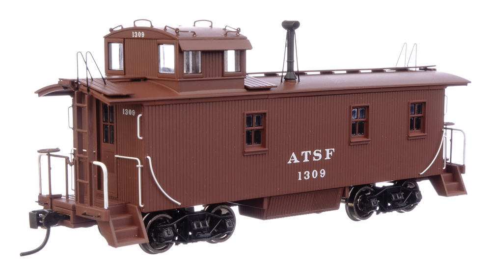 A model caboose in a marron paint scheme