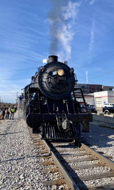 Steam locomotive sits on display. 