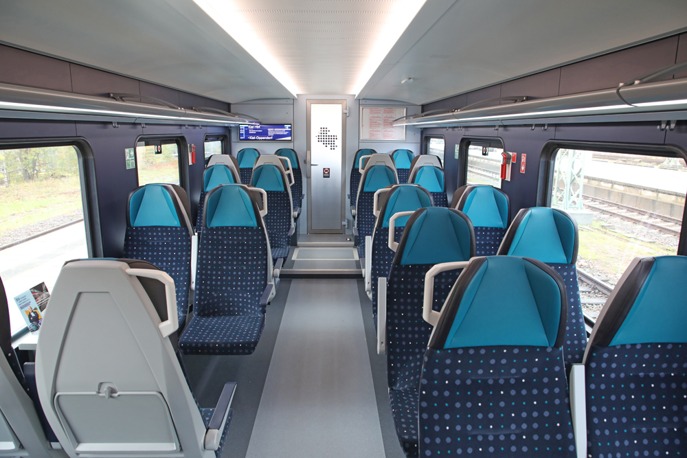 Interior of passenger car with two-tone blue seats