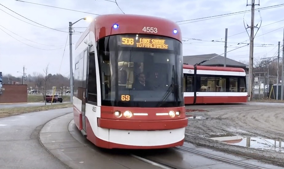 Multi-unit light rail vehicle rounding tight curve