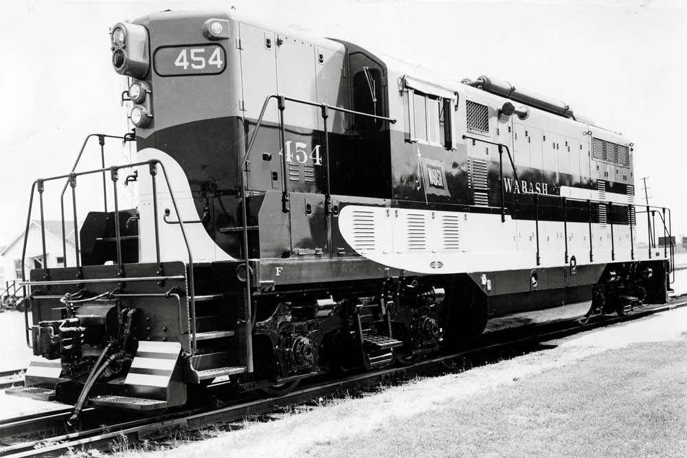 Two tone diesel Wabash locomotives in field with no train