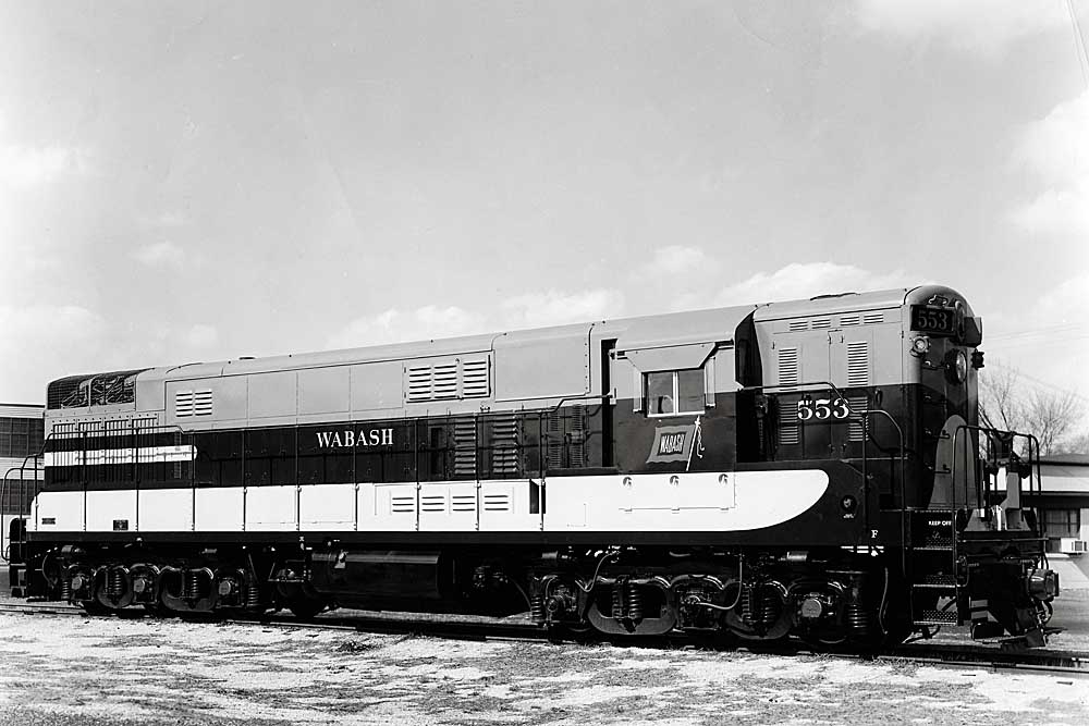 Two tone diesel Wabash locomotives in field with no train