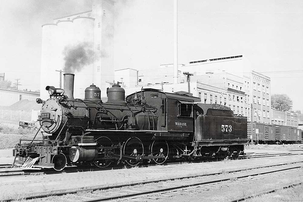 Steam Wabash locomotives with factory behind