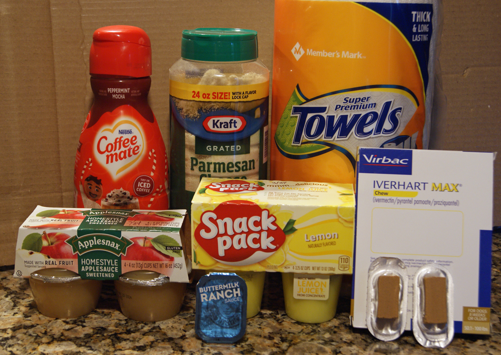 assortment of food and paper towels on kitchen counter