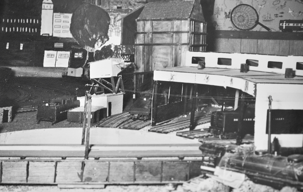 black and white photo of toy train layout