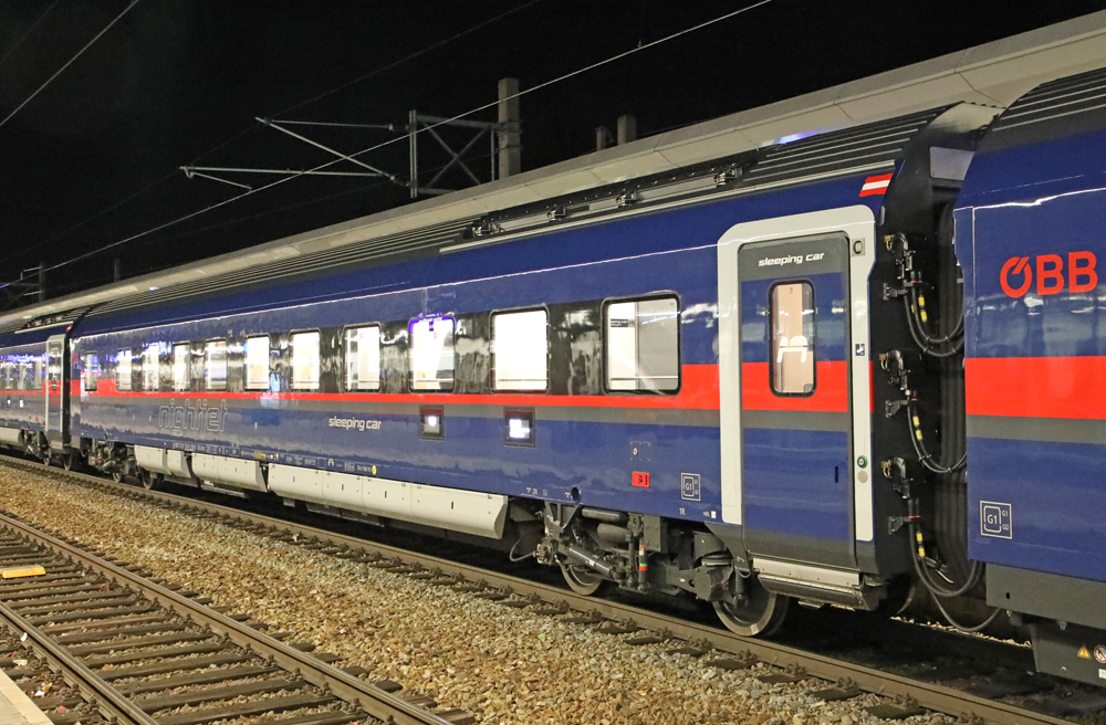 Dark blue passenger car with red stripe