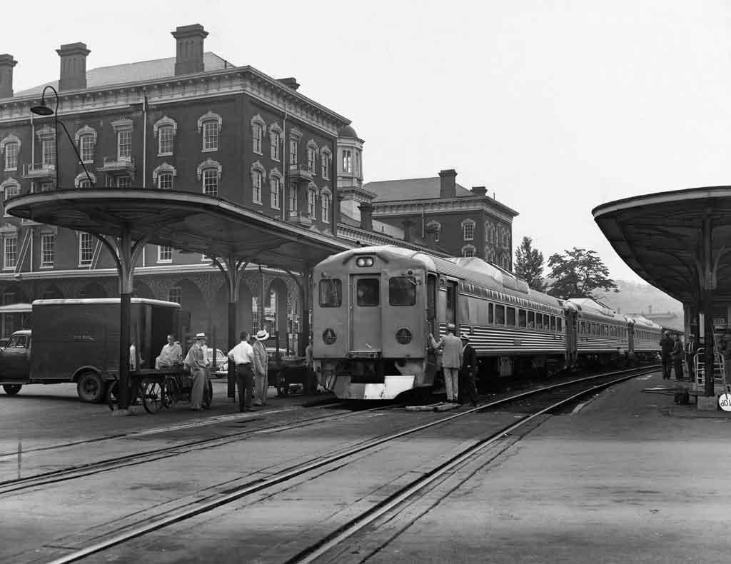 Stainless steel Budd Rail Diesel Car (RDC) at brick station