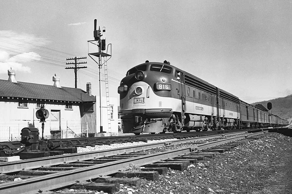 Streamlined diesel locomotive on passenger train