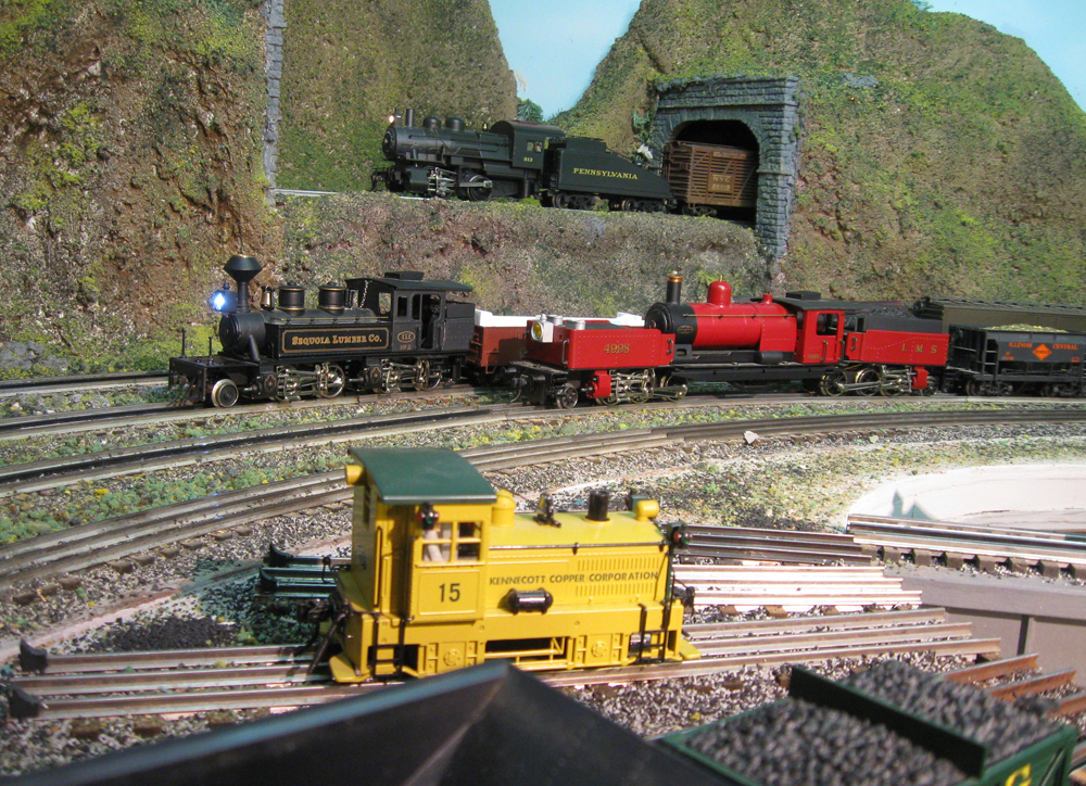 three model locomotives on layout