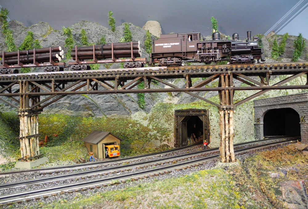 model train on bridge on layout