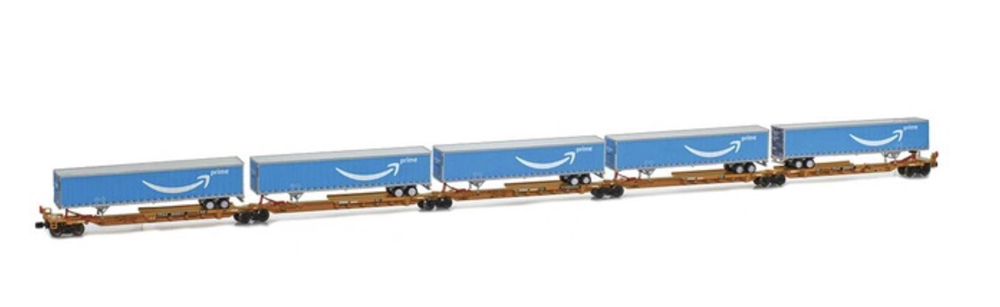 A set of four model freight cars with load