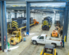 locomotives inside shop with white truck