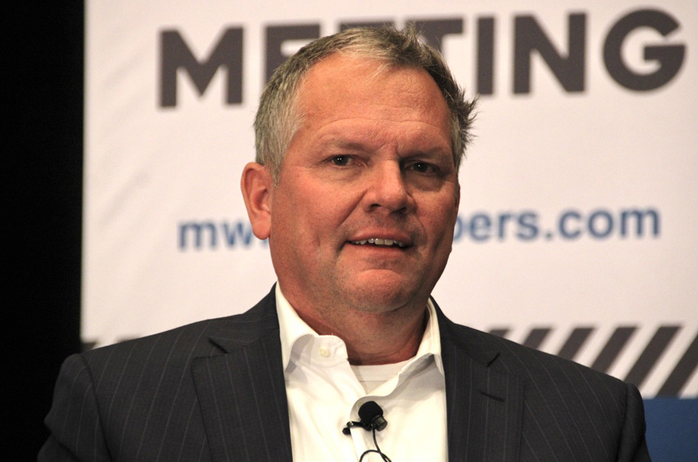 Man in black coat and white tie