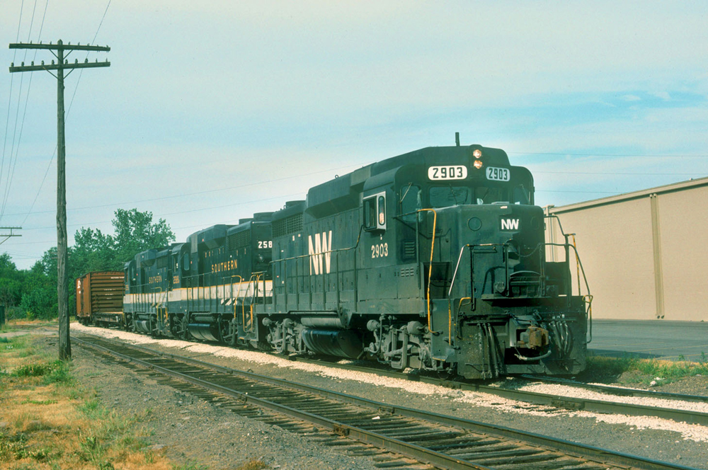 black and white diesel locomotive on track