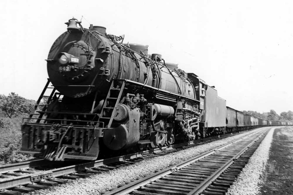 Steam locomotive with freight train on curve