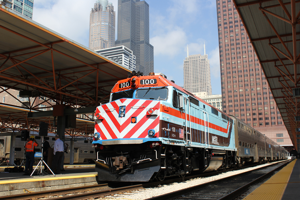 Metra train with red and white stripes on nose
