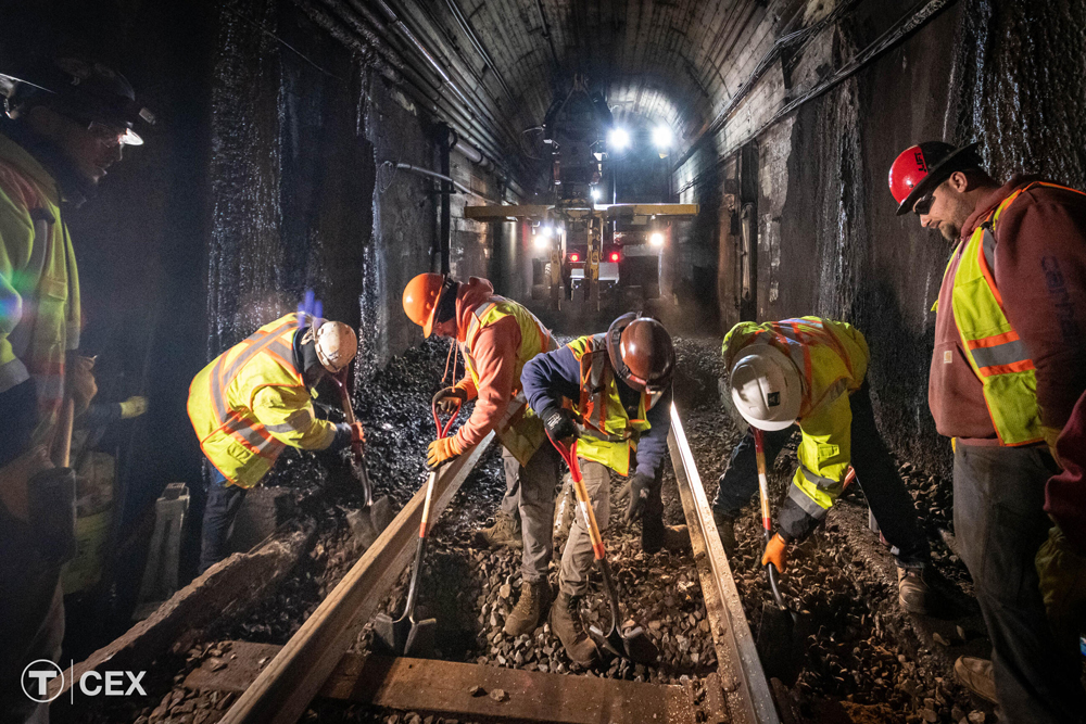 Men working in subway tunnel