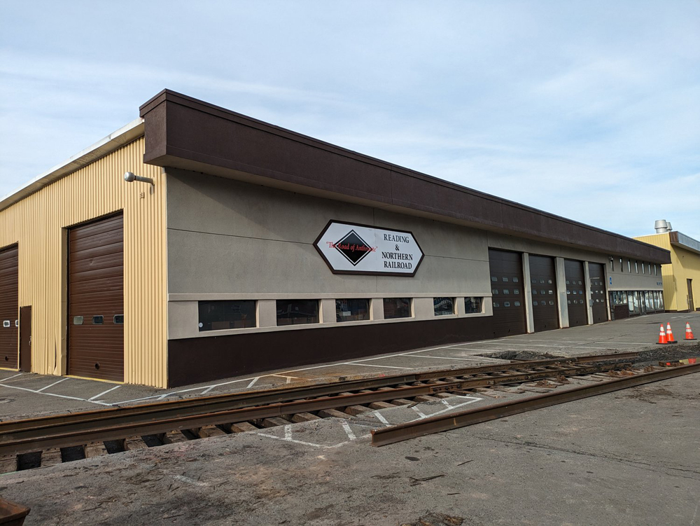 Building with large doors and sign for Reading & Northern Railroad