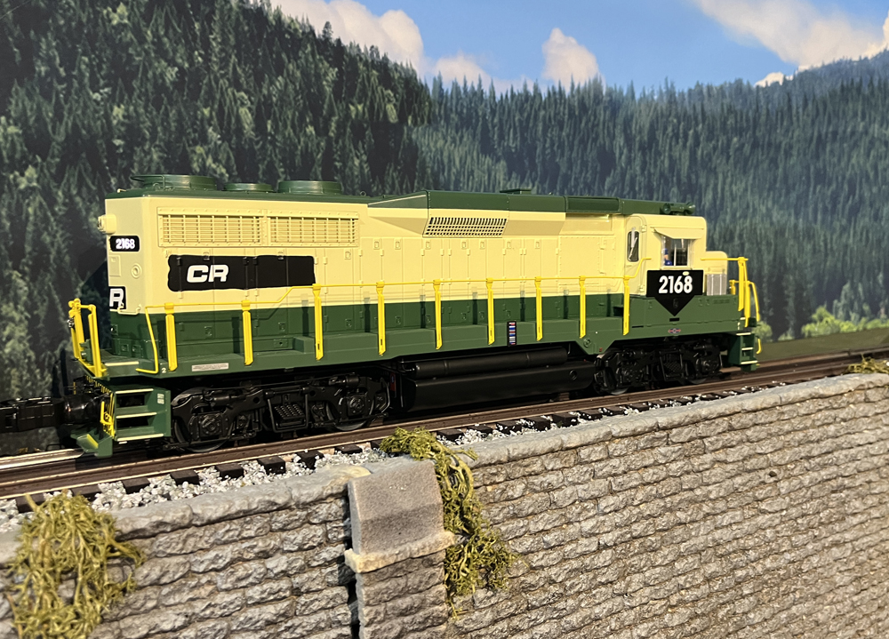 yellow and green model locomotive