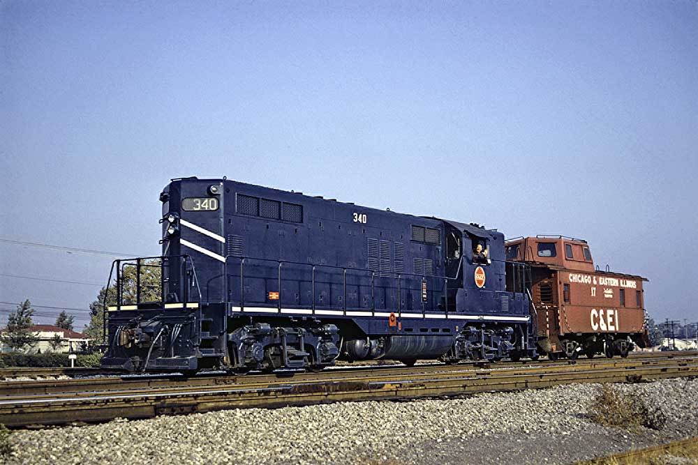 Blue-and-white diesel Chicago & Eastern Illinois locomotives with red caboose