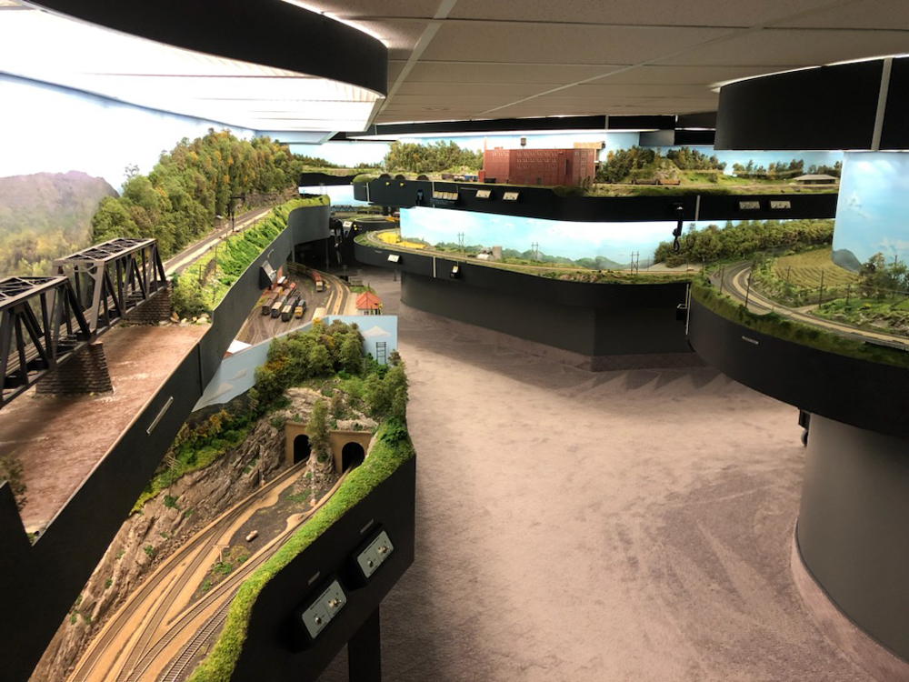 backed off shot of model railroad layout in a room