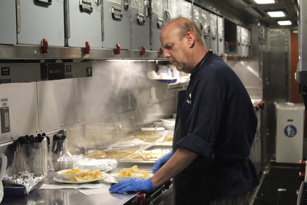 Chef working in kitchen of dining car