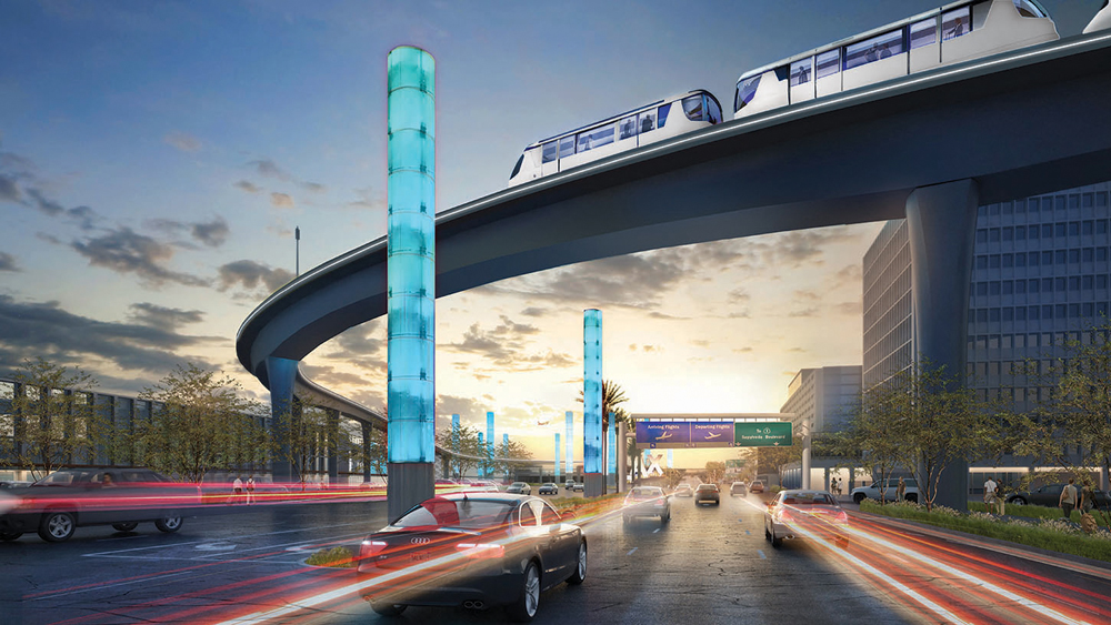 Automated people mover on bridge over street