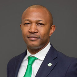 Man in blue coat and green tie
