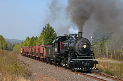 Scene from the past: steam locomotive moves ore cars donated by Canadian National