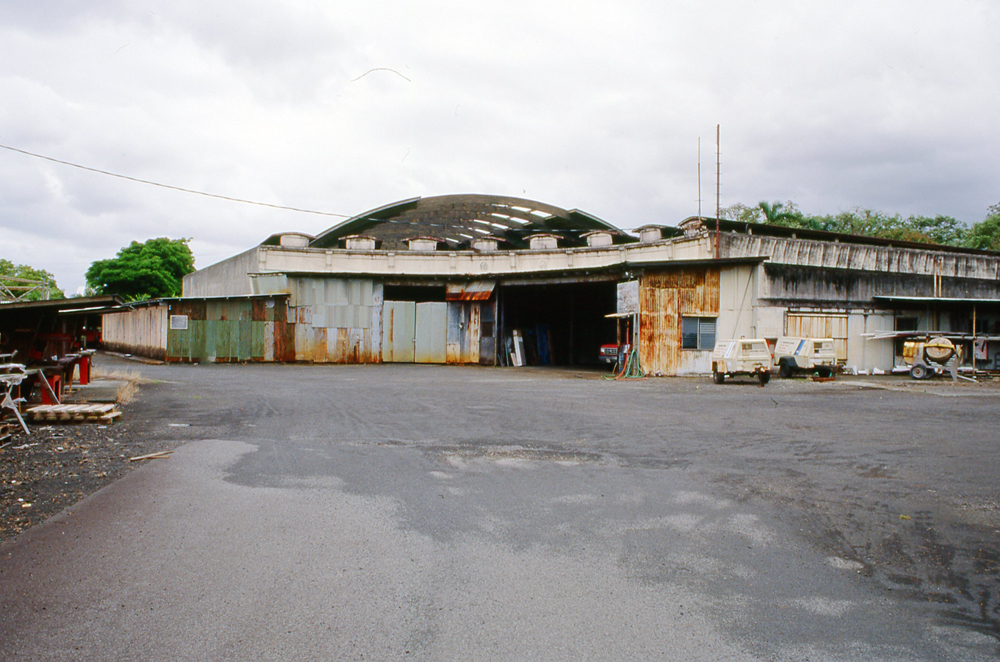 old roundhouse building with trucks