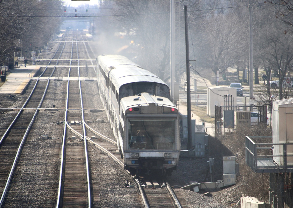 Passenger car with large glass window at rear of train