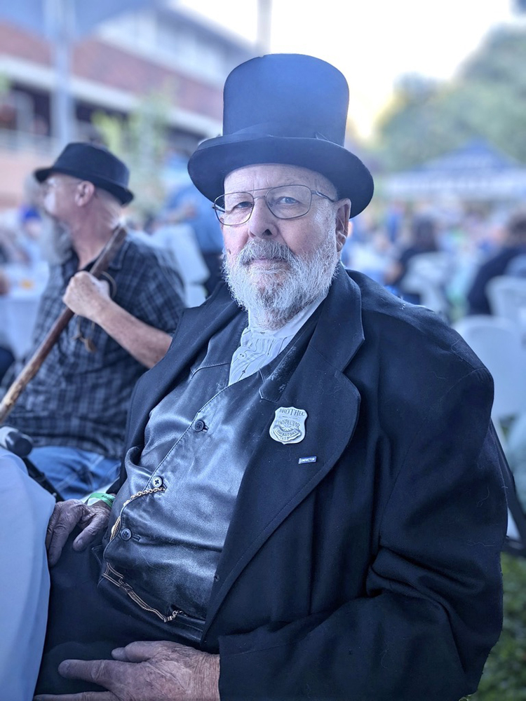 Man in period costume including badge