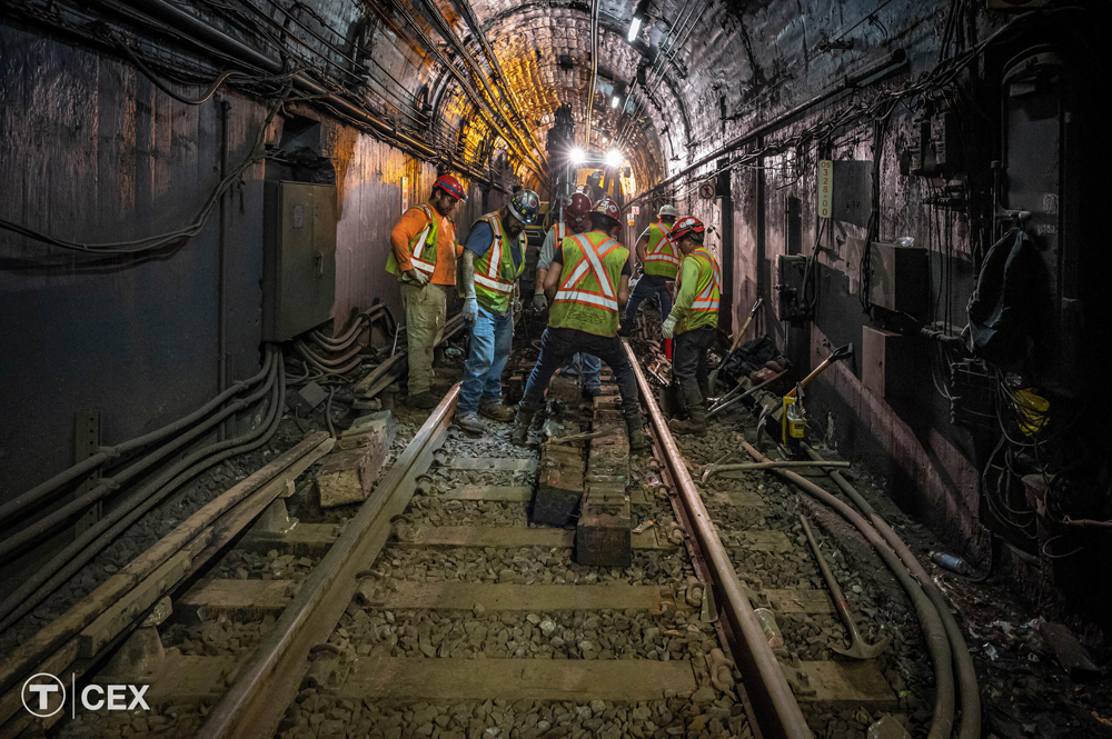 Maintenance workers in subway tunnel