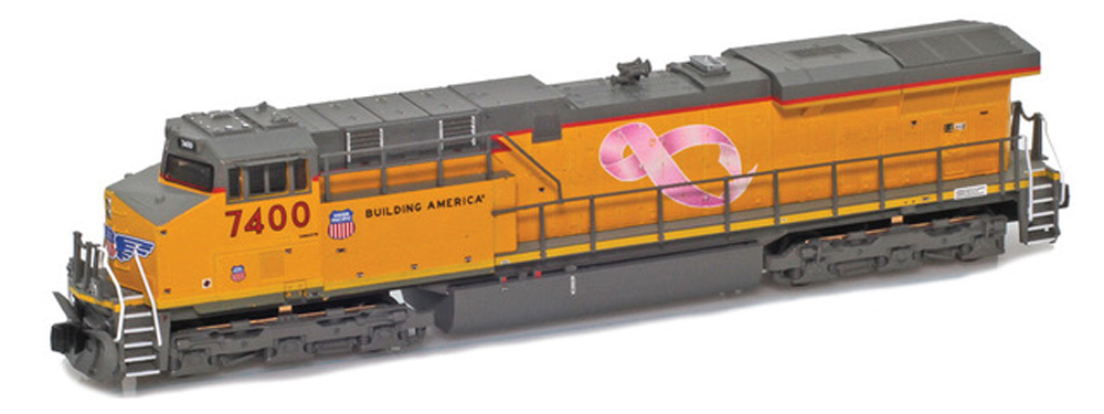 A yellow and gray model locomotive